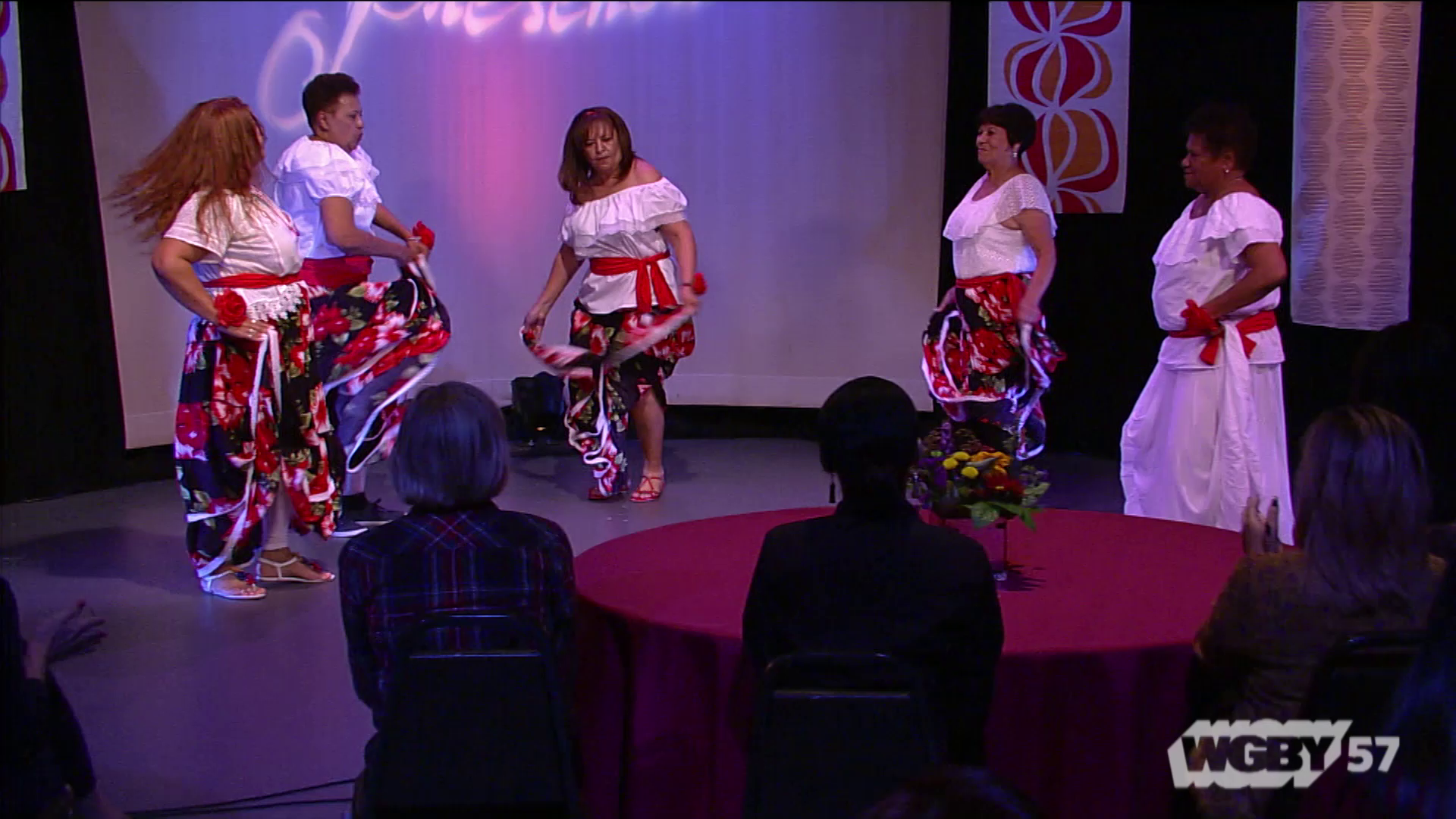 Amapolas is a group of Bomba and Plena dancers, 55 years of age and older, from Holyoke Senior Center Here, they dance to the song, "Quinto y Tumbador."